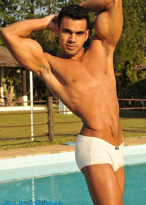 Handsome gay stallion Poax strips poolside & shows his muscular body & big rod