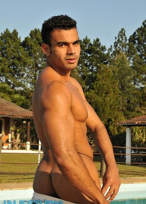 Handsome gay stallion Poax strips poolside & shows his muscular body & big rod