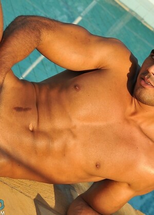 Handsome gay stallion Poax strips poolside & shows his muscular body & big rod