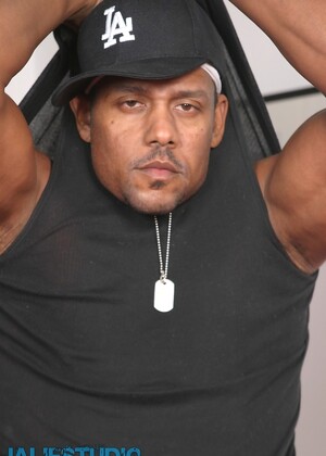 Hot gay ebony Aron Ridge unveils his muscular body and big black dick