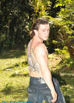 Inked gay hottie Arcanjo Amaro strips & unveils his sexy abs & big dick
