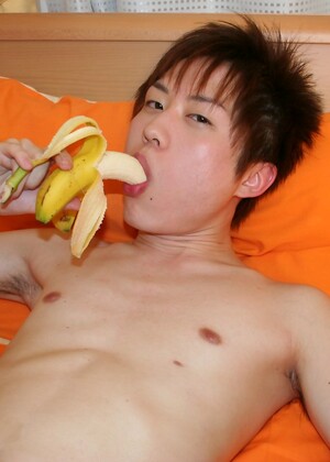Cute Korean boy playing with his banana