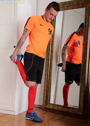 Tattooed boy Dom Ully jerks off with his Nike shoe.
