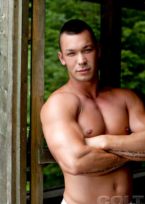 Hot muscle hunk shows his shaved cock outdoors