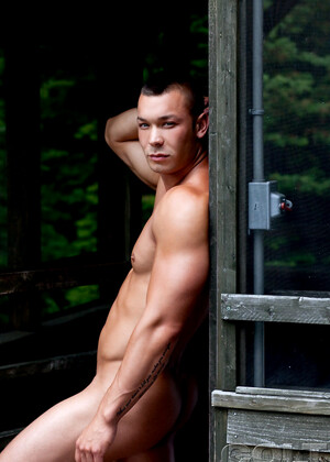 Hot muscle hunk shows his shaved cock outdoors