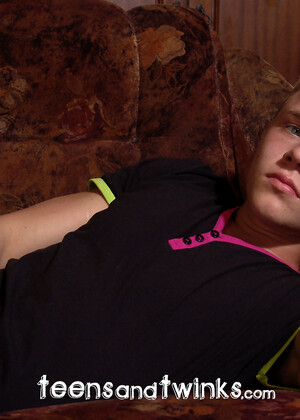 Muscled twink Alick rubs down his finely-tuned physique for the camera
