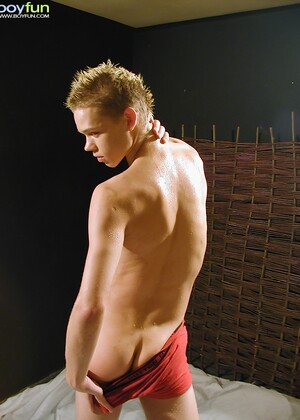 Blonde twink Mason oils up his tight smooth body.