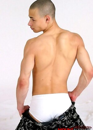 Sexy twink with a tasty uncut cock, chiseled body and a sexy bad boy shaved head.