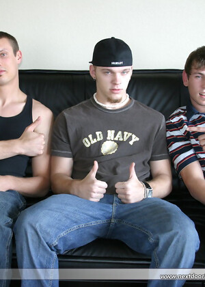 Three horny guys pull out their dicks and masturbate together on a couch