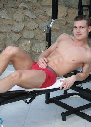 Attractive gay model Diago exposes his six pack and dick at the gym