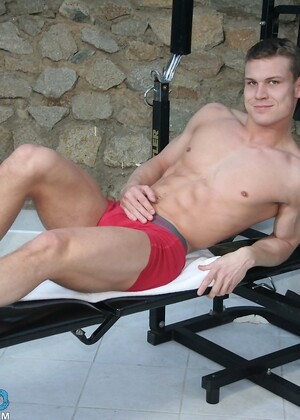 Attractive gay model Diago exposes his six pack and dick at the gym