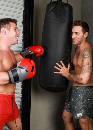 Muscular gay athletes Carter Woods & Kyle Fletcher strip & fuck at the gym