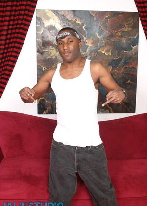 Naughty ebony gay model JD Daniels strips and unveils his monster dick