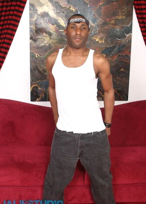 Naughty ebony gay model JD Daniels strips and unveils his monster dick