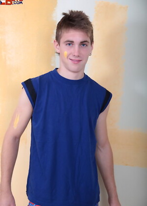 Handsome twink painting wall