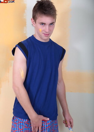 Handsome twink painting wall