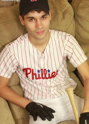 Athletic stud London Sawyer jerks off after baseball game.