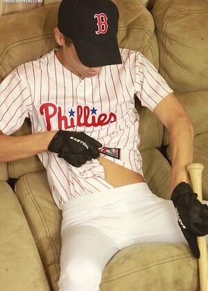 Athletic stud London Sawyer jerks off after baseball game.