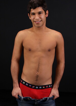 Carmine posing naked in a bedroom