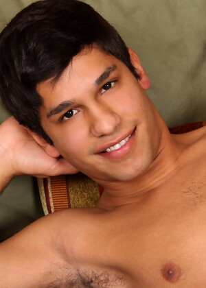 Carmine posing naked in a bedroom