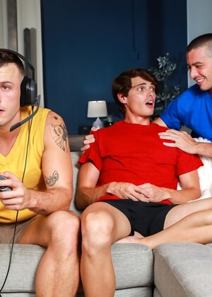 Muscular gay amateurs undress and bang hard in bareback couch action
